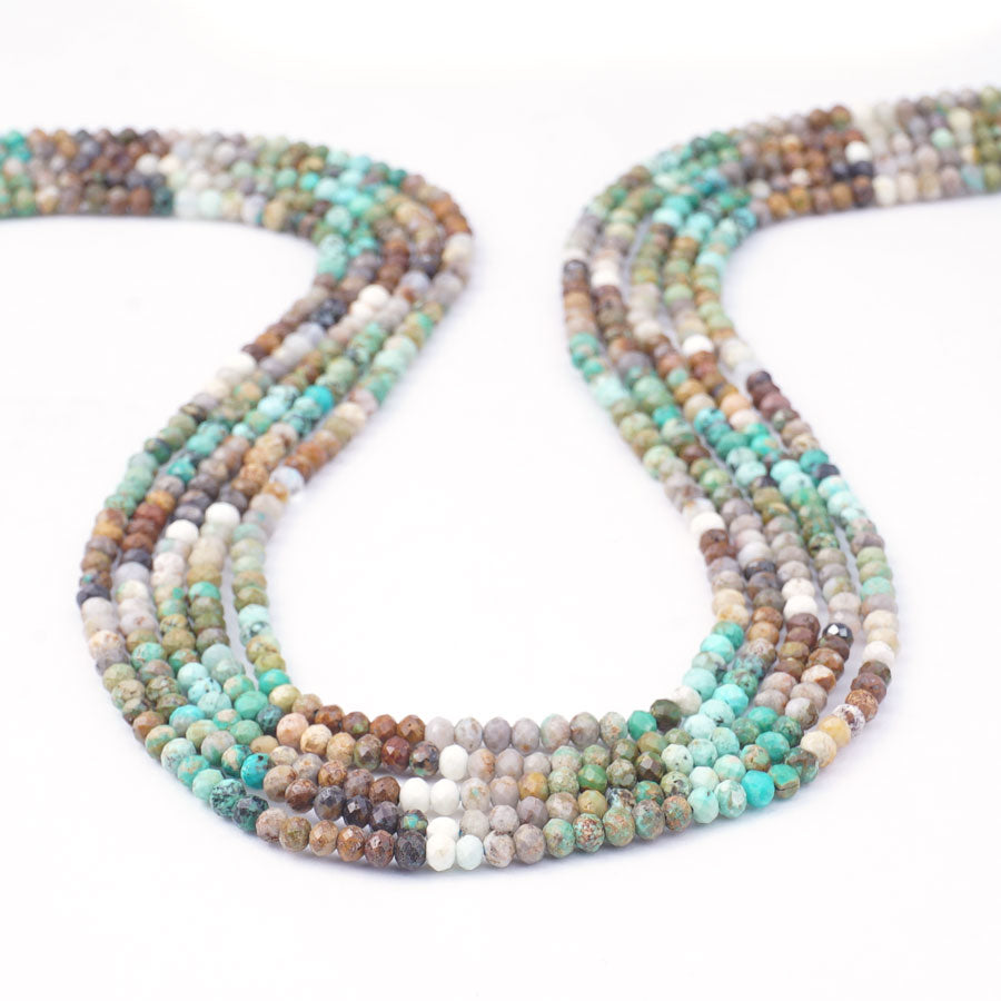 Hubei Turquoise 2X3mm Microfaceted Rondelle Light Blue/Green/Black Banded - Limited Editions - Goody Beads